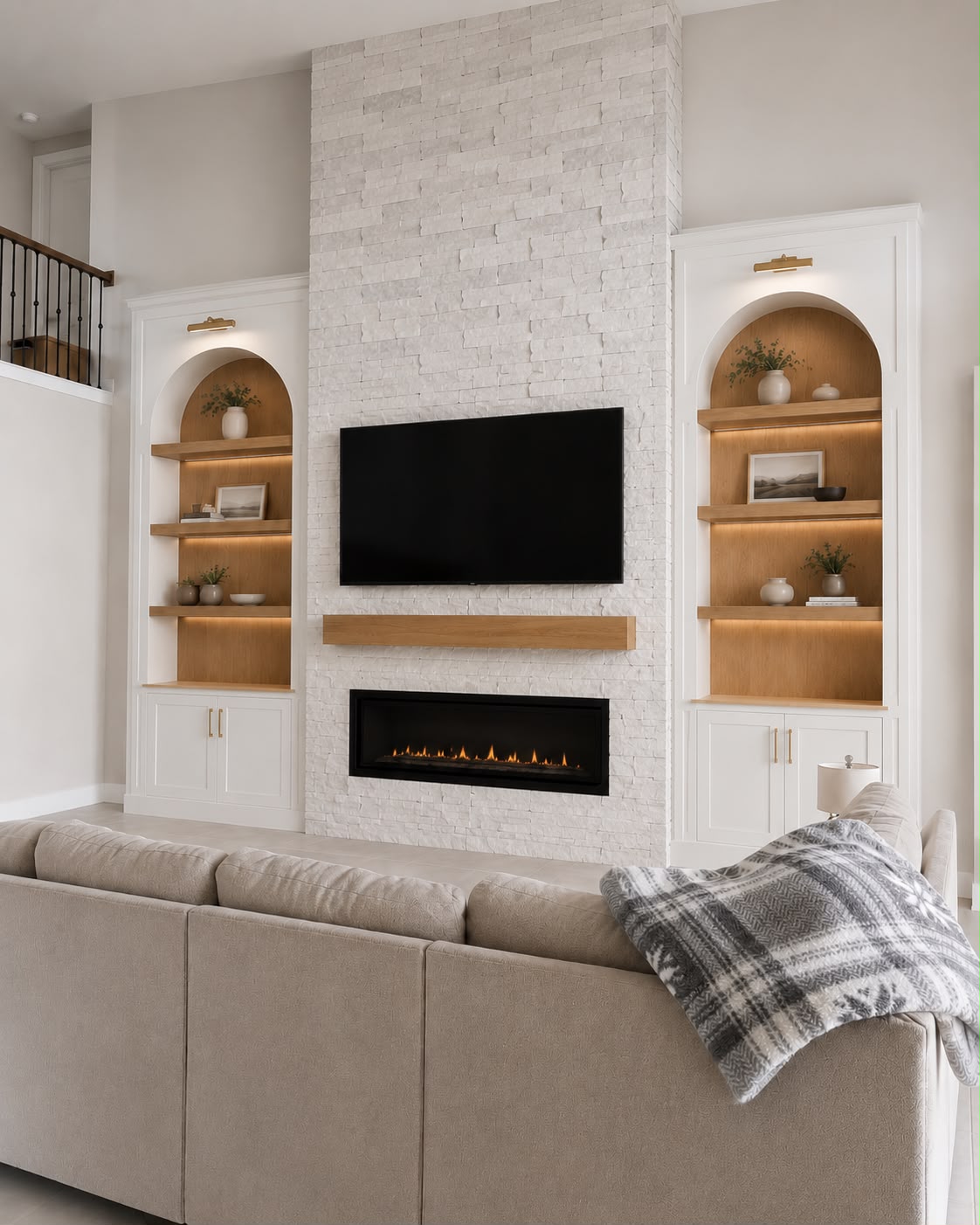 White custom TV wall with fireplace