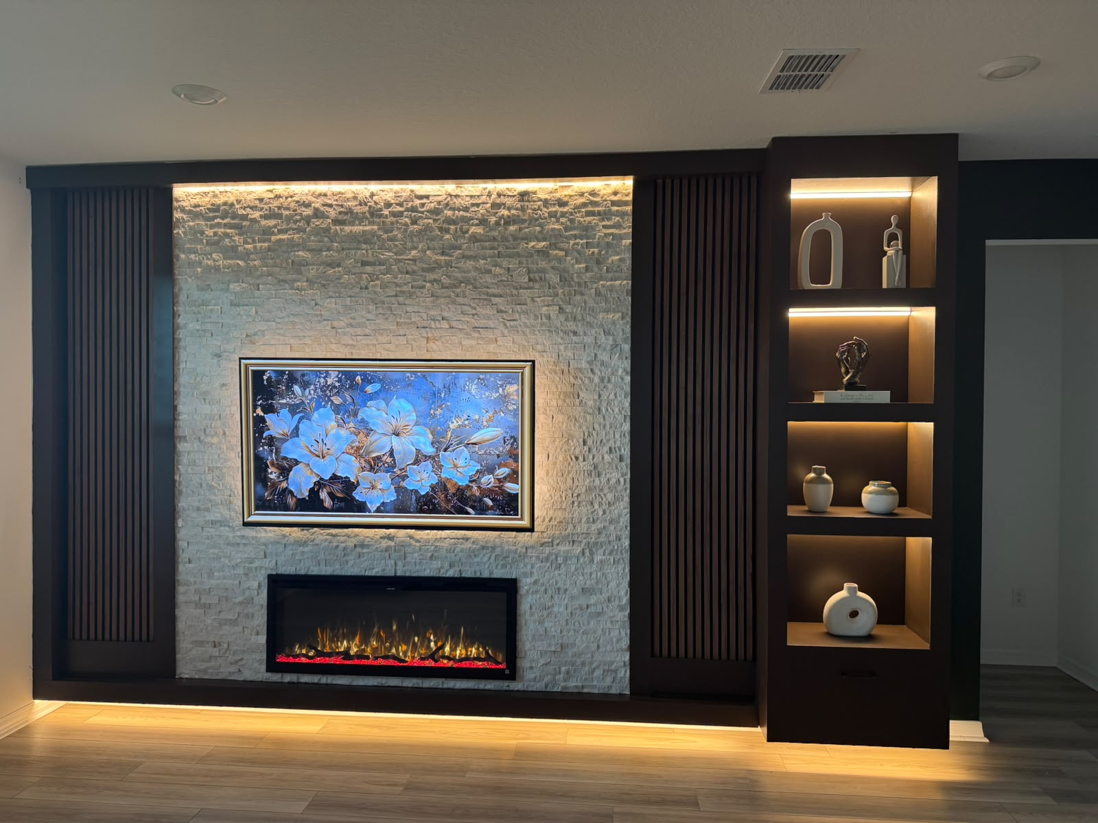Luxury TV wall with fireplace by LuxeForm Remodeling
